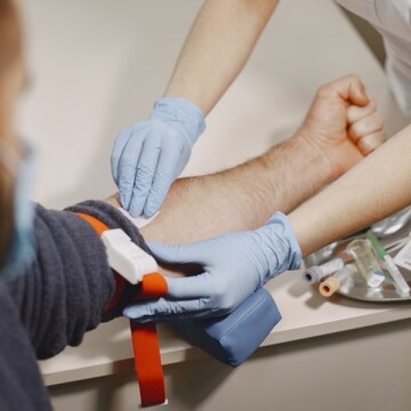 skillful-nurse-is-doing-blood-test-man-clinic-man-medical-mask_1157-48824